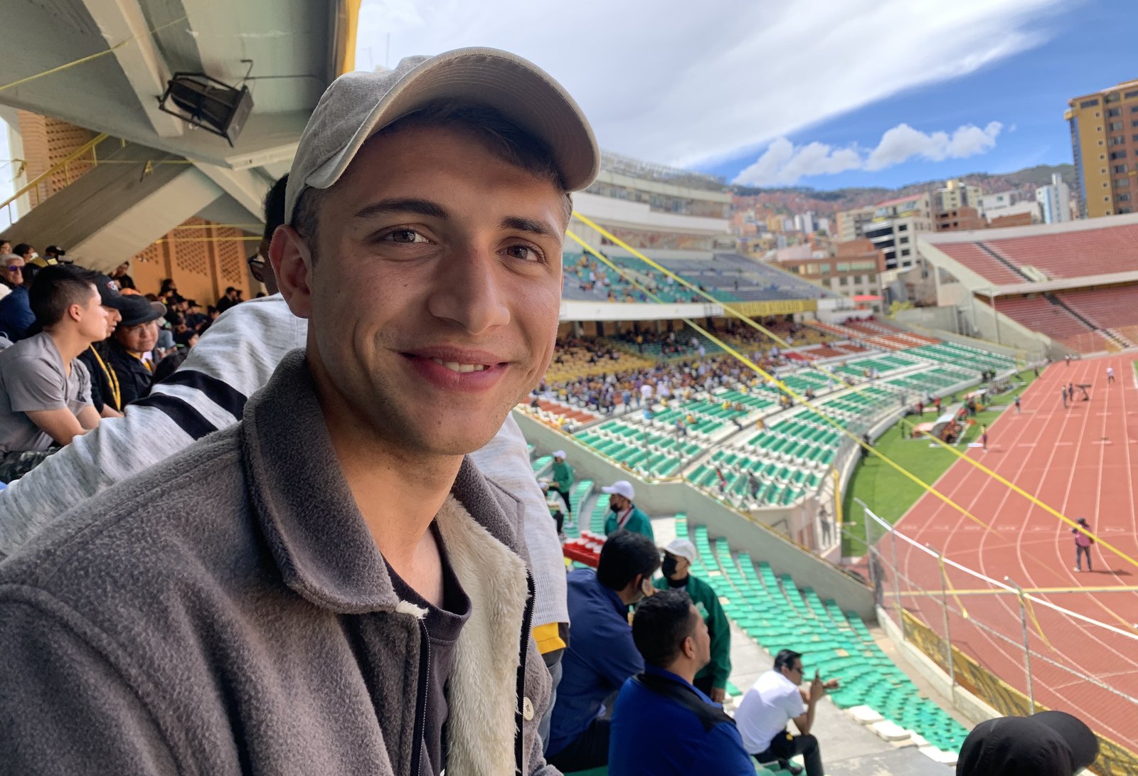 Max Llahuet watching a football match at a stadium in La Paz, Bolivia